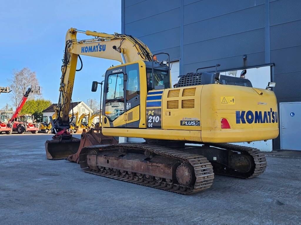 2016 Komatsu PC210LC-10 crawler excavator, rear three-quarter view 2016 Komatsu PC210LC-10 crawler excavator, rear three-quarter view