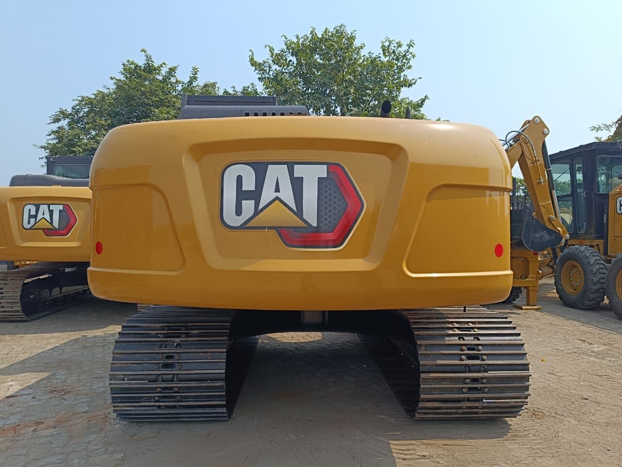 2025 Caterpillar 320D3 Crawler Excavator showing the rear counterweight with a large CAT logo. 2025 Caterpillar 320D3 Crawler Excavator showing the rear counterweight with a large CAT logo.