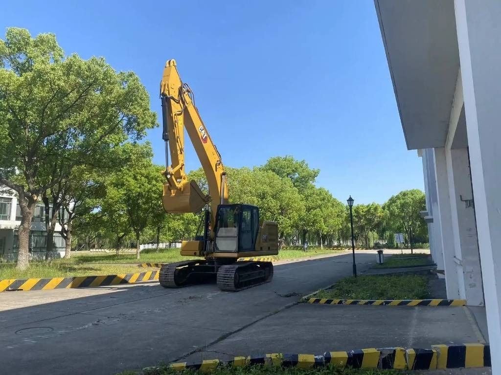 2018 Caterpillar 320GC mini excavator, side profile view