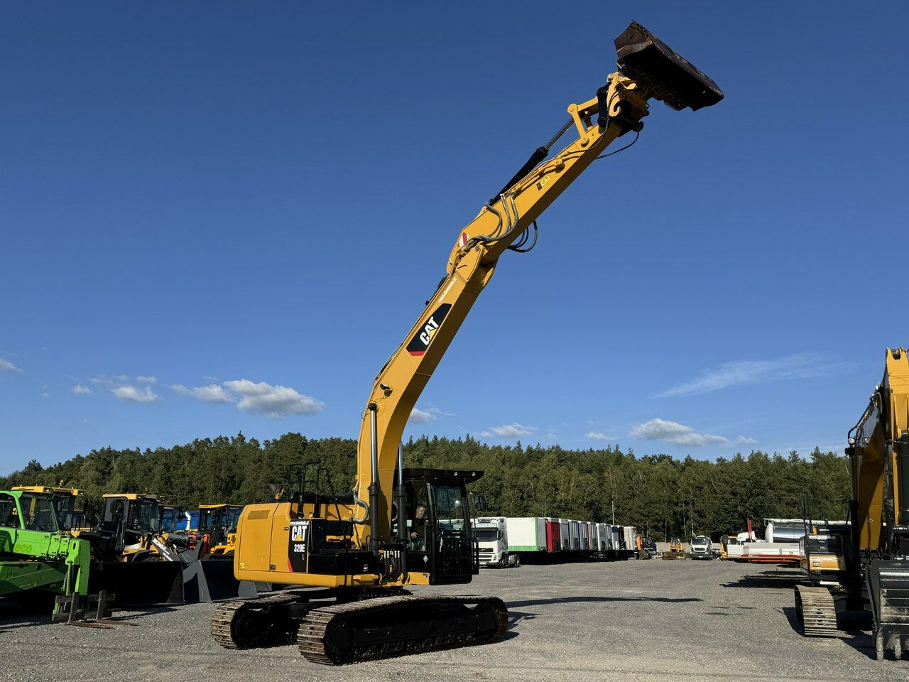 2015 Caterpillar 320EL crawler excavator, side view with boom raised