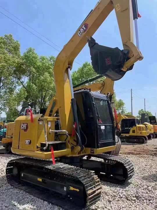 2024 Caterpillar 307E mini excavator, rear three-quarter view
