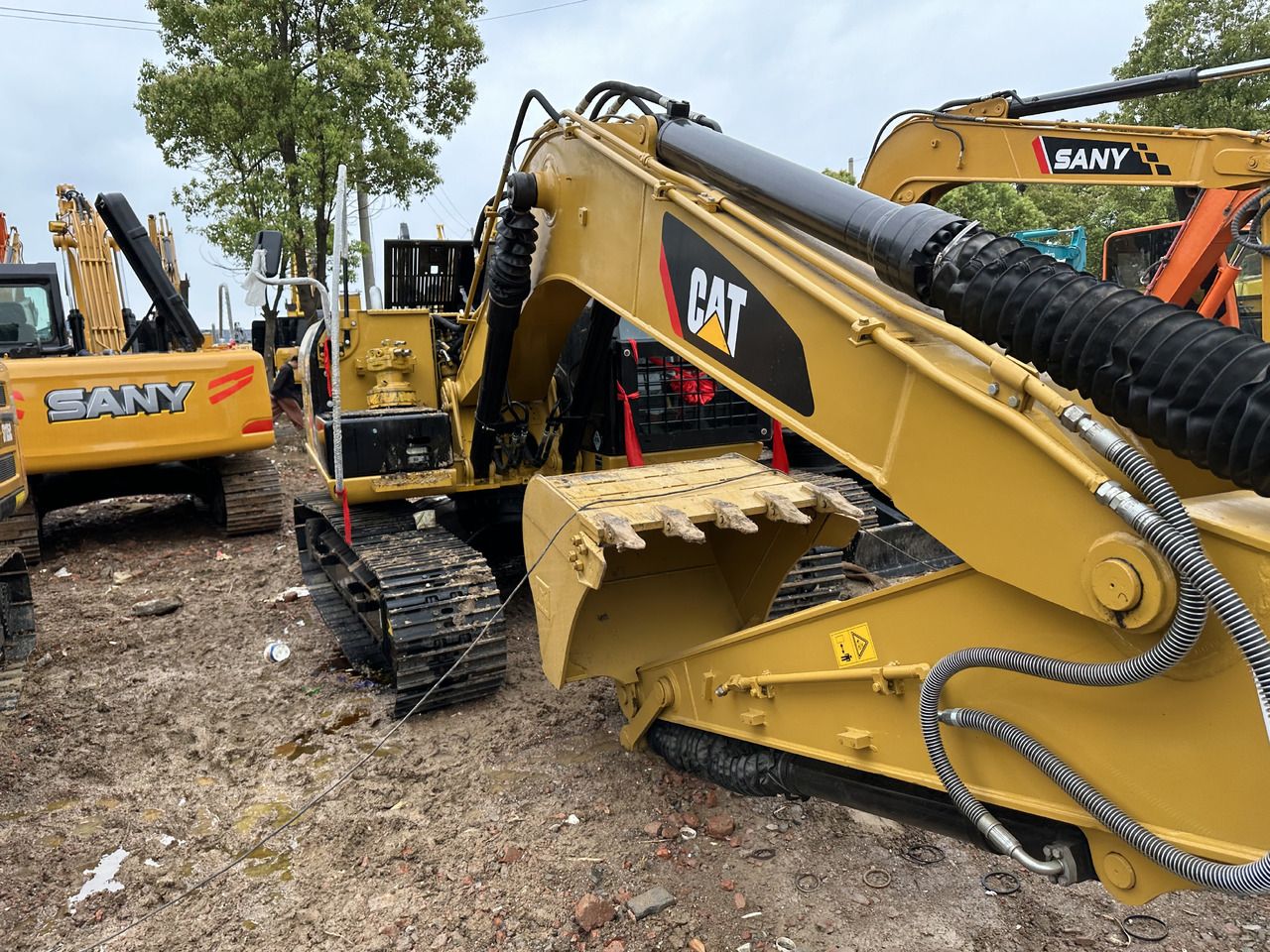 2020 Caterpillar 313D crawler excavator, side view of boom and bucket