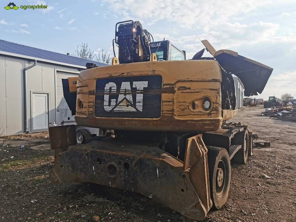 2008 Caterpillar M318D material handler rear view