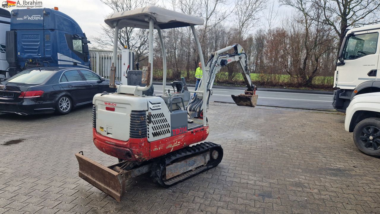 2009 Takeuchi TB014 mini excavator, rear three-quarter view