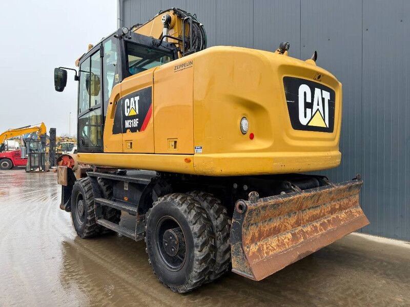 2015 Caterpillar M318F wheel excavator, rear three-quarter view