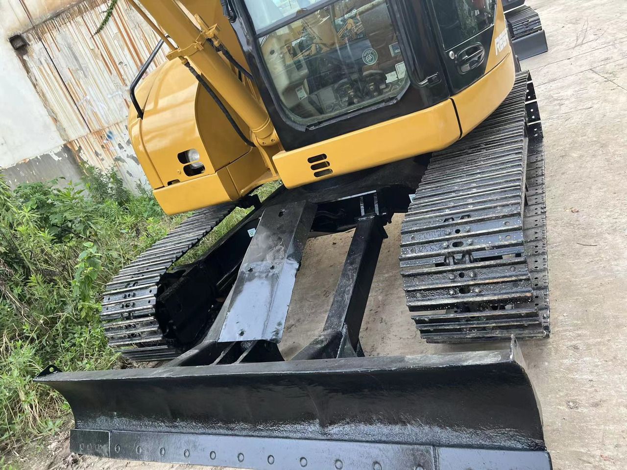 2021 Caterpillar 308C mini excavator front view with blade