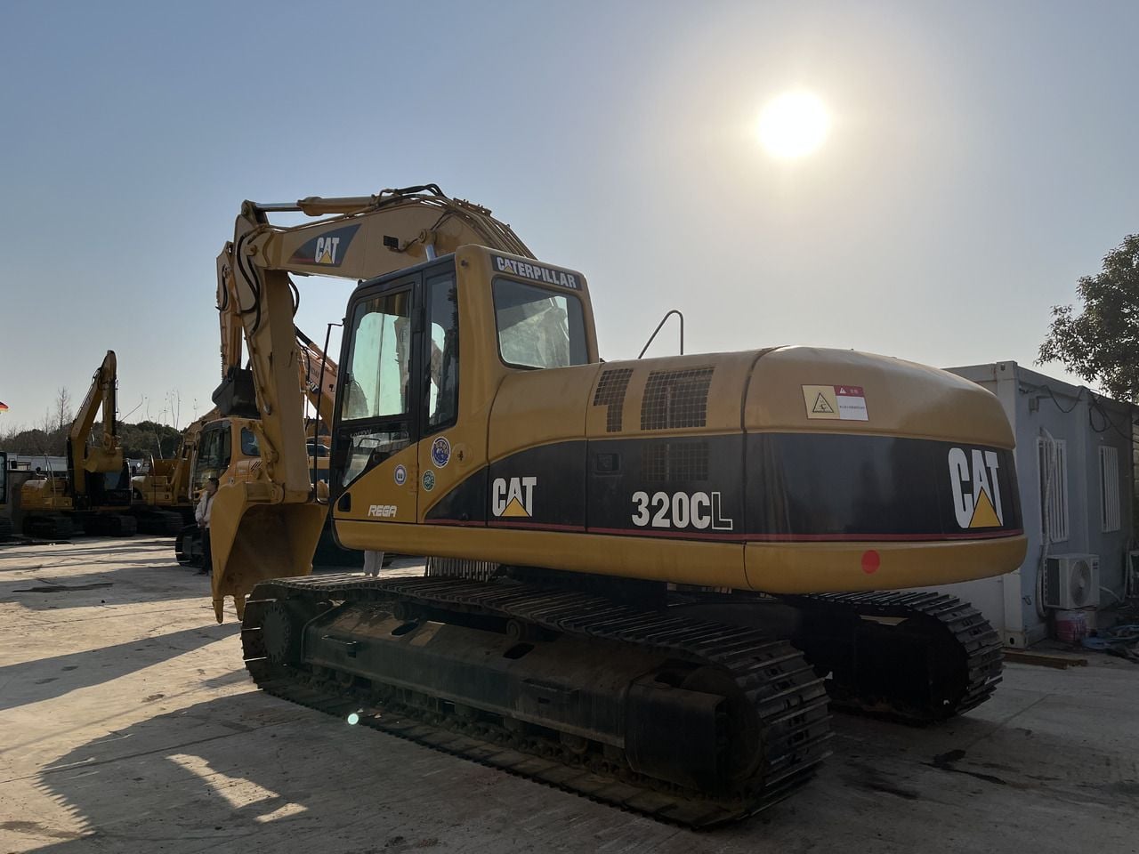 2010 Caterpillar 320CL crawler excavator, rear three-quarter view 2010 Caterpillar 320CL crawler excavator, rear three-quarter view