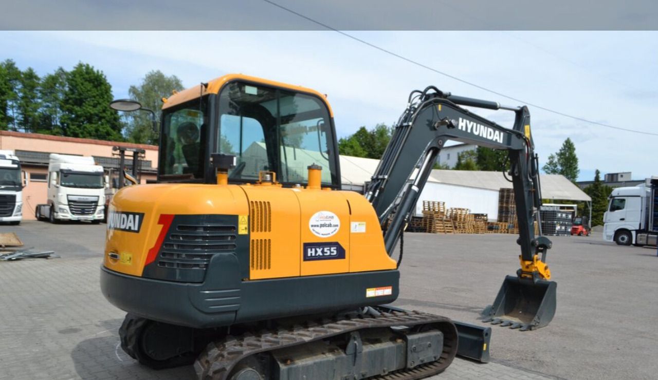 2021 Hyundai HX55 mini excavator rear three-quarter view