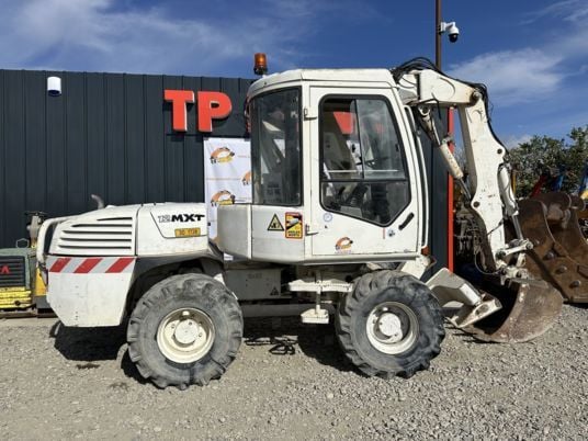 2005 Mecalac 12MXT wheel excavator side view