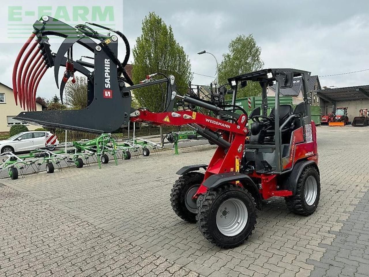 2023 Weidemann 1190E mini excavator with grapple attachment, side view 2023 Weidemann 1190E mini excavator with grapple attachment, side view