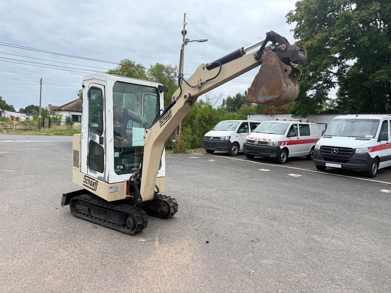 1995 Schaeff HR 12 mini excavator, side view