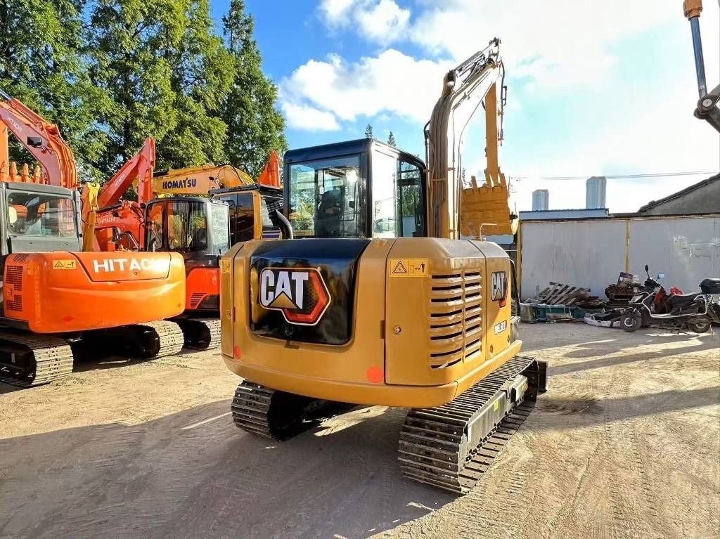 2022 Caterpillar 305.5 mini excavator, rear three-quarter view