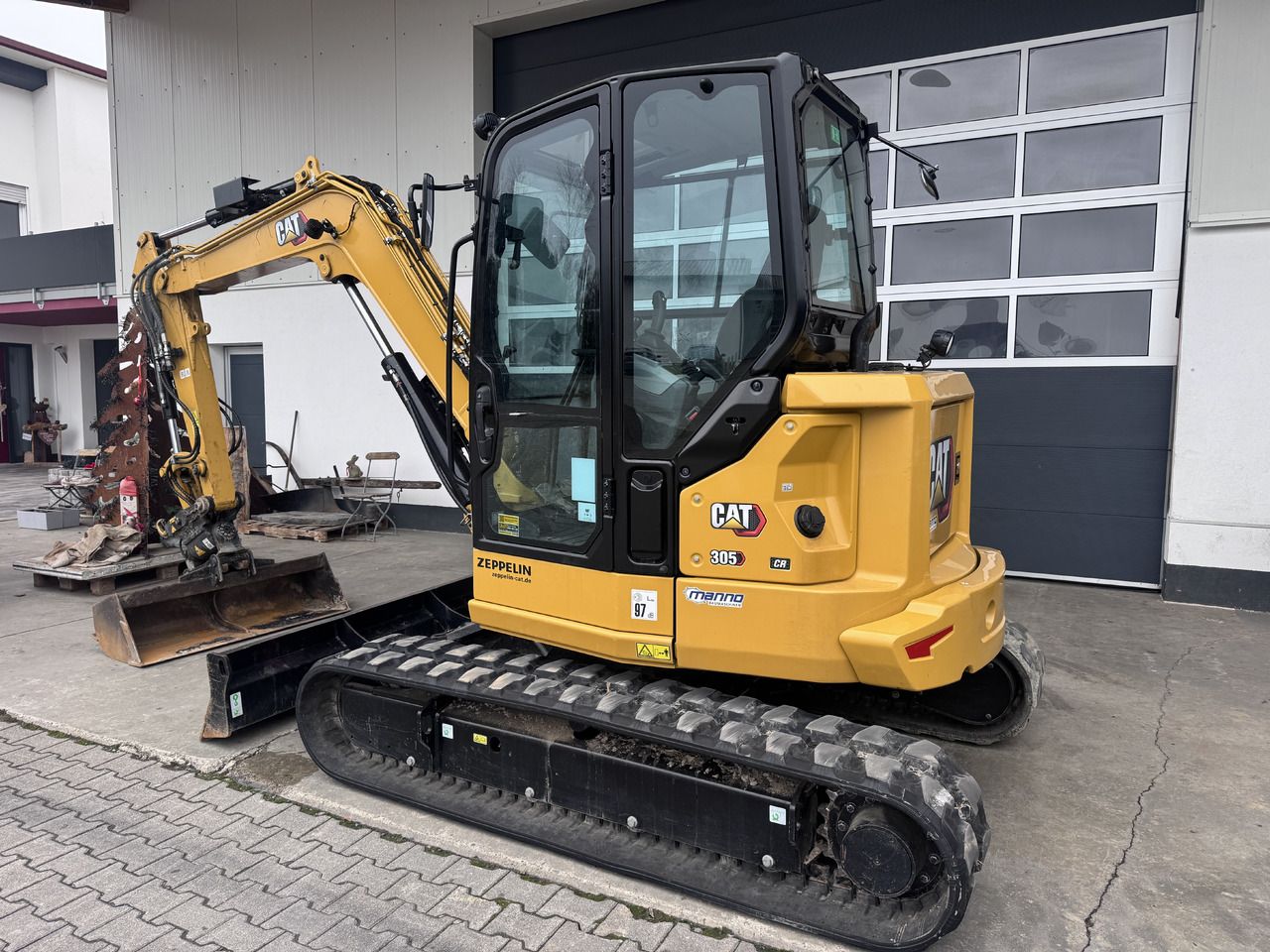 2024 Caterpillar 305 CR mini excavator, rear three-quarter view