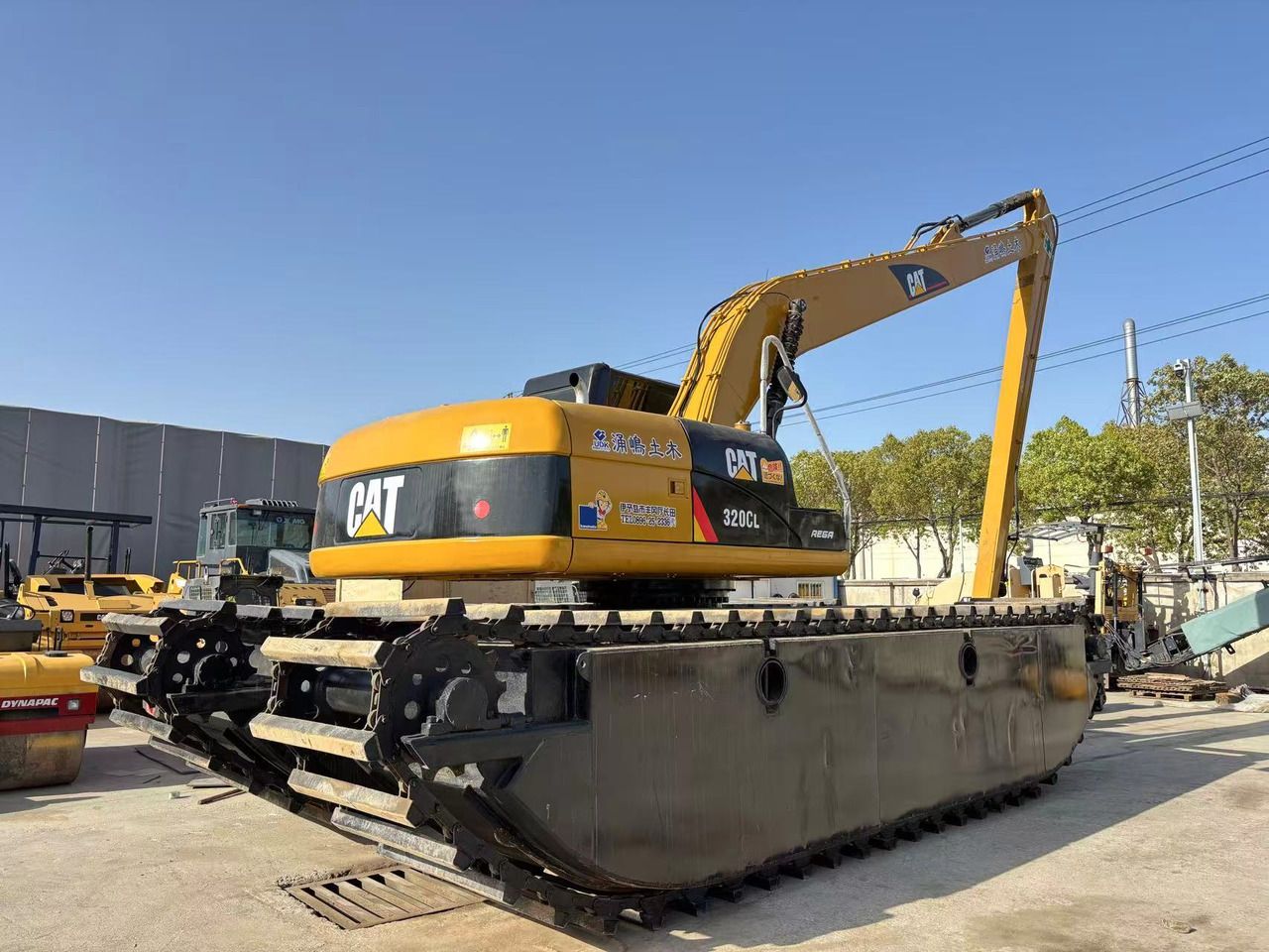 2016 Caterpillar 320CL amphibious excavator, rear three-quarter view