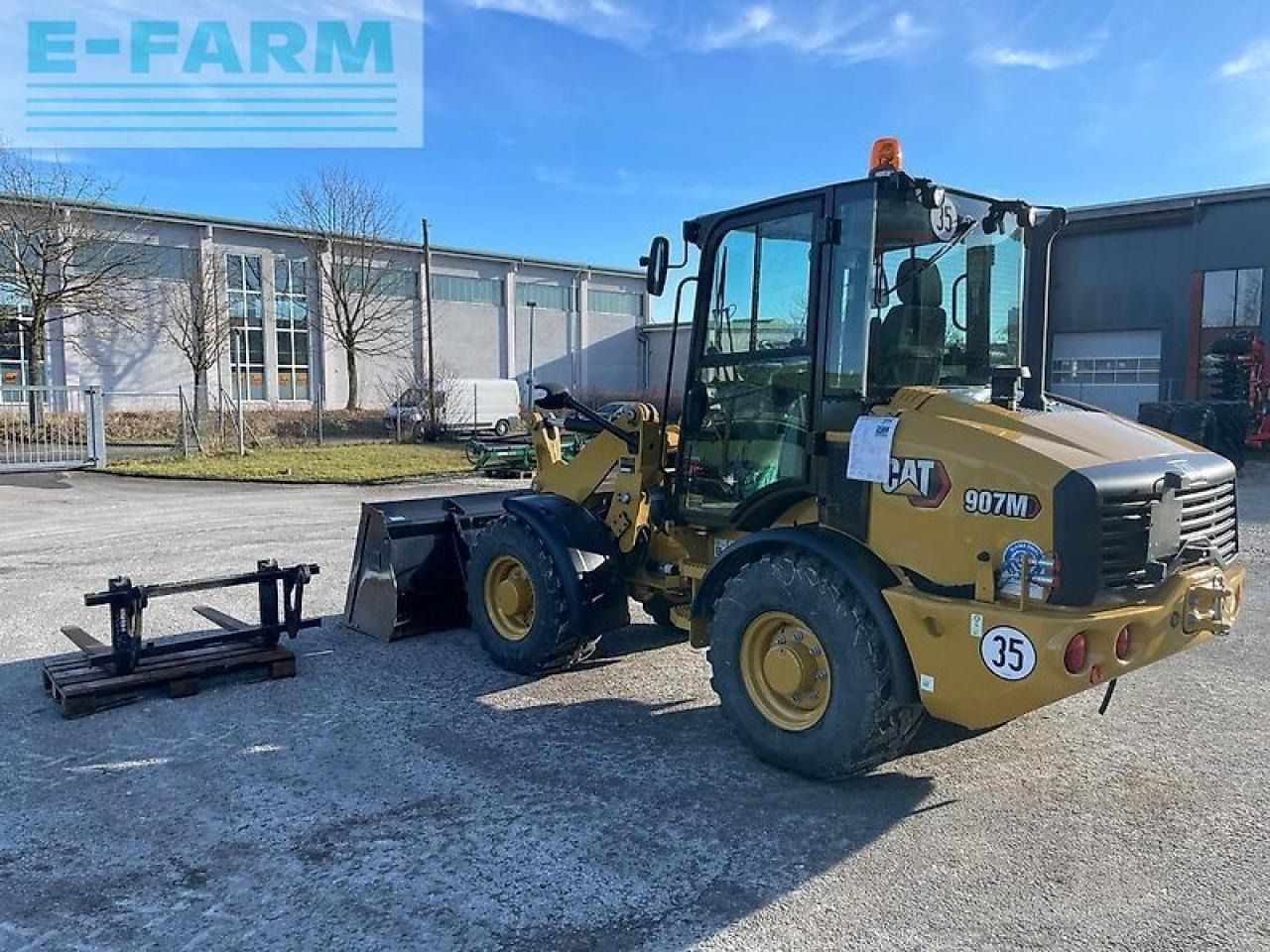 2021 Caterpillar 907M wheel loader, side view 2021 Caterpillar 907M wheel loader, side view