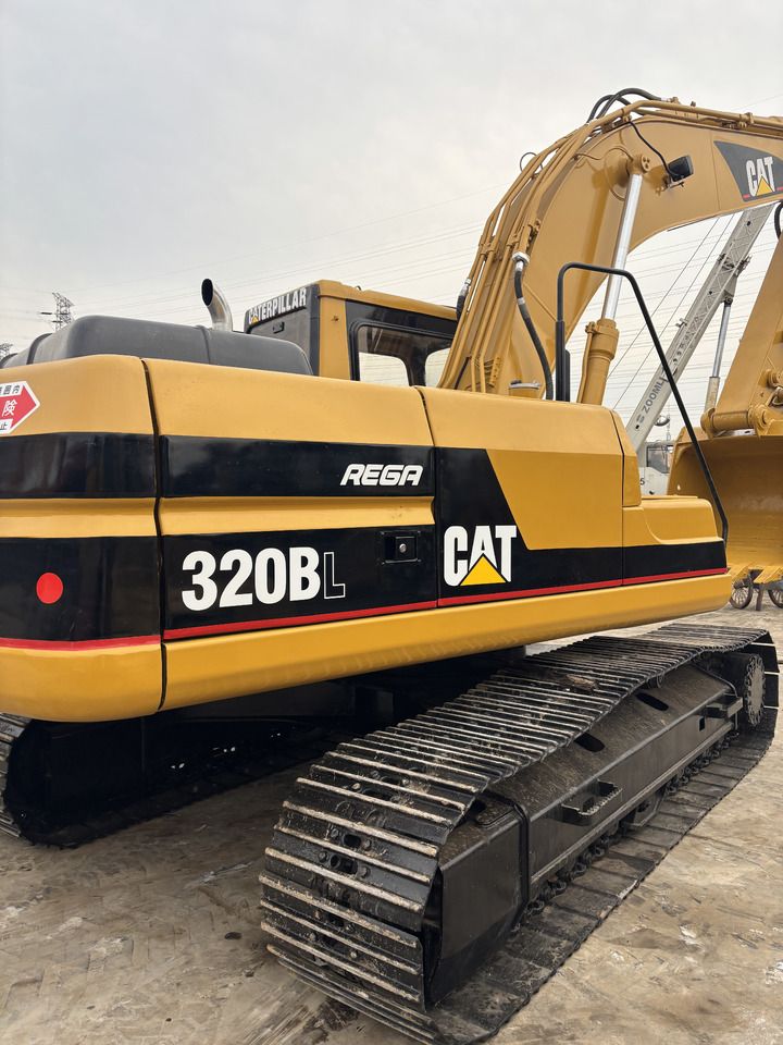 2023 Caterpillar 320BL crawler excavator, rear three-quarter view