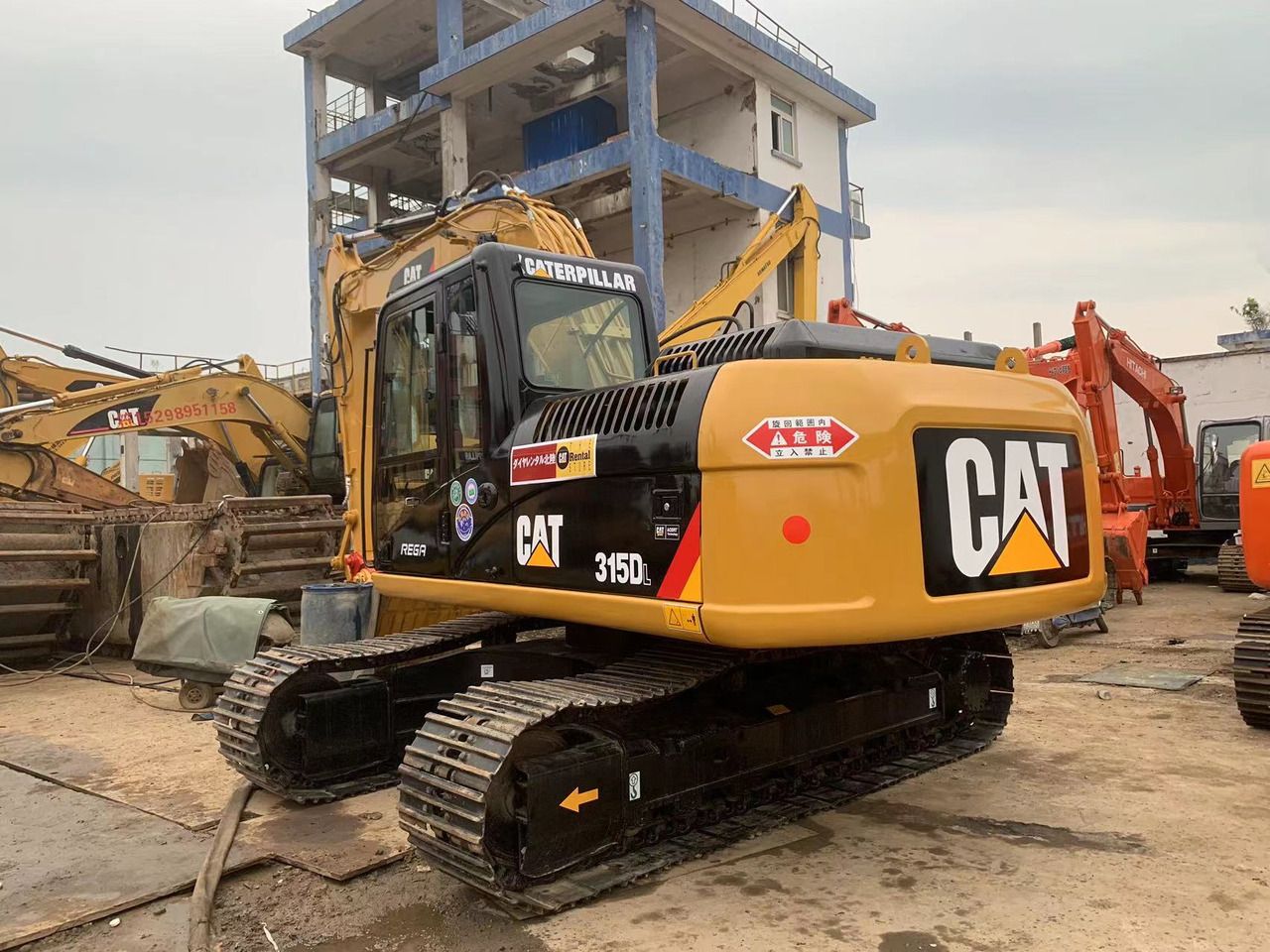 2018 Caterpillar 315D crawler excavator, rear three-quarter view