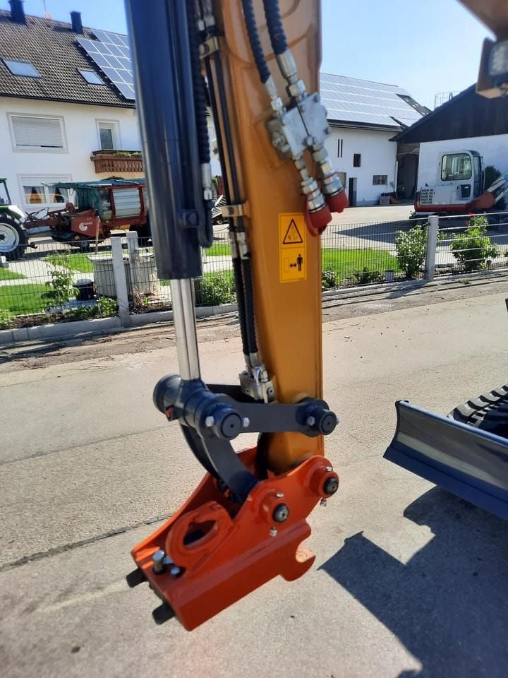 Kubota XE27E mini excavator boom and quick coupler detail Kubota XE27E mini excavator boom and quick coupler detail