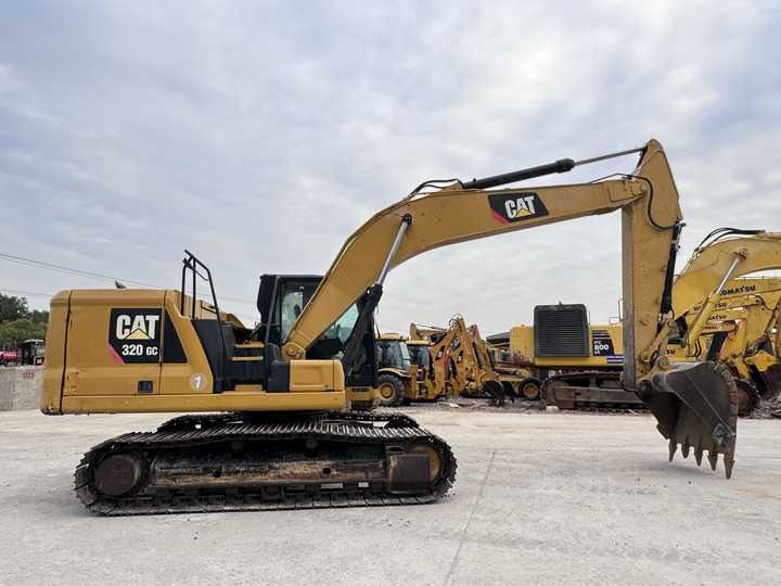 Caterpillar 320GC crawler excavator, side profile view