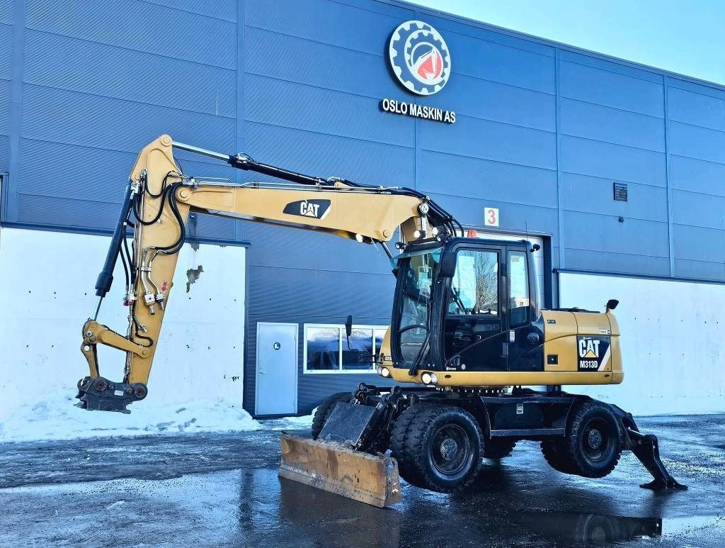 2012 Caterpillar M313D wheel excavator, side profile view