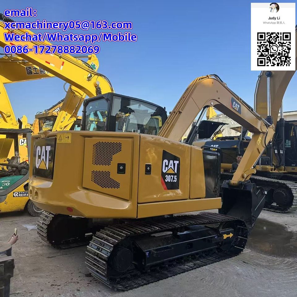 2023 Caterpillar 307.5 mini excavator, rear three-quarter view