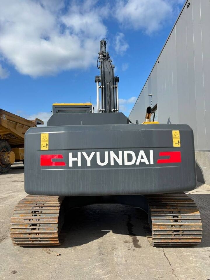 2025 Hyundai R245LR Crawler Excavator from the rear, emphasizing the large 'HYUNDAI' logo on the dark gray counterweight.