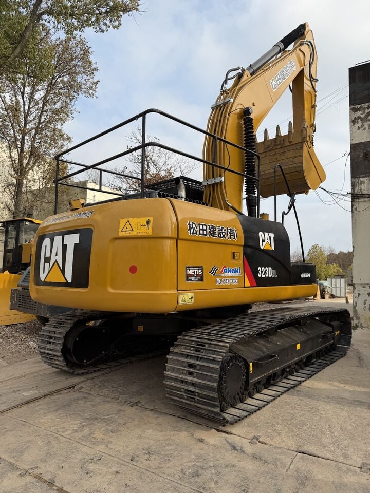 2025 Caterpillar 323D2L crawler excavator, rear three-quarter view