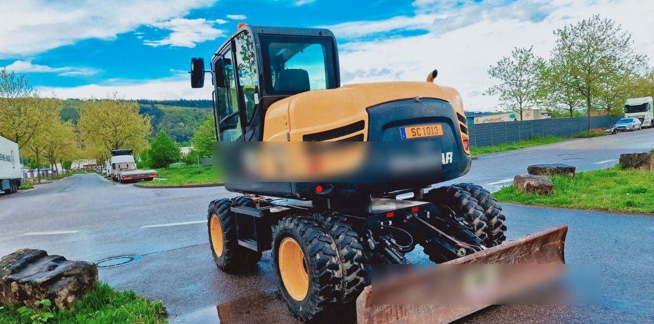 2020 Yanmar B95W wheel excavator, rear three-quarter view