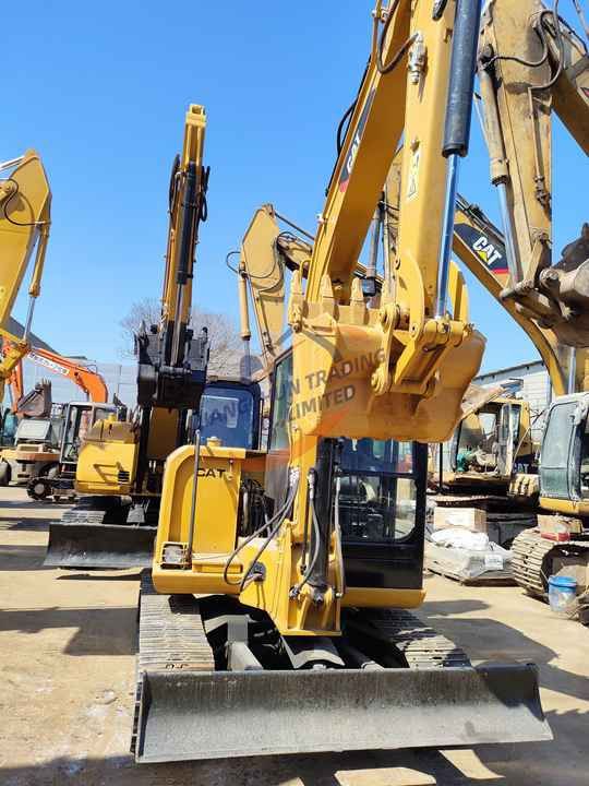 2020 Caterpillar 306E2 crawler excavator, front view with blade