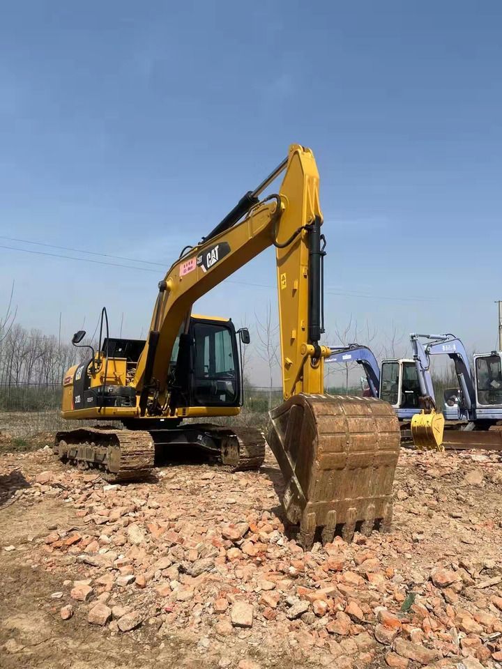 2023 Caterpillar 313D2 crawler excavator, front three-quarter view
