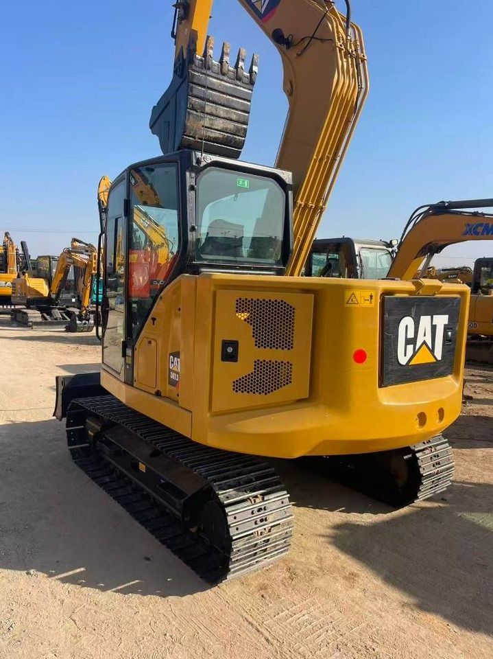 2024 Caterpillar 307.5 mini excavator, rear three-quarter view