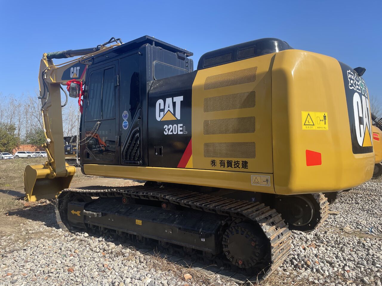 2024 Caterpillar 320EL crawler excavator, rear three-quarter view