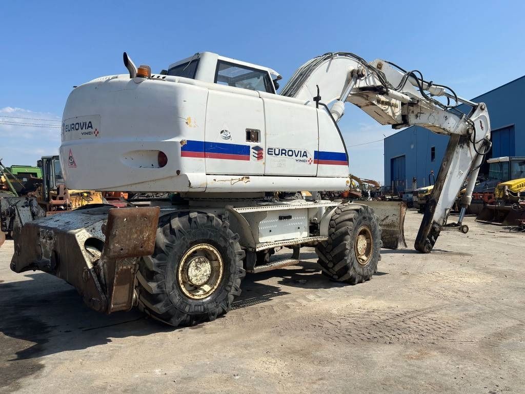 2008 New Holland MH-PLUS wheel excavator, rear three-quarter view