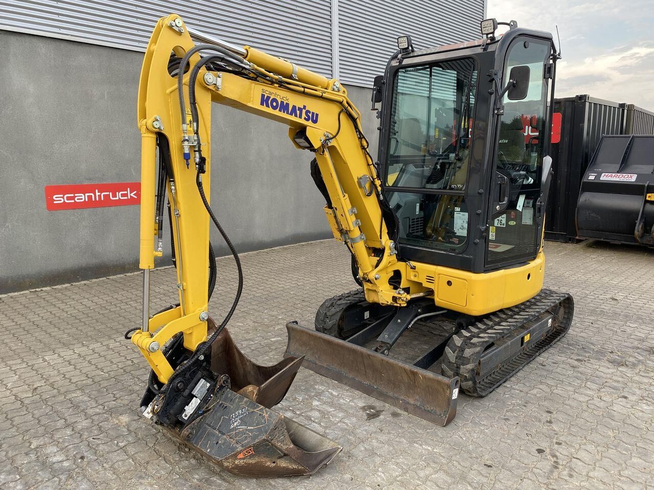 2023 Komatsu PC24MR-5 mini excavator, front three-quarter view