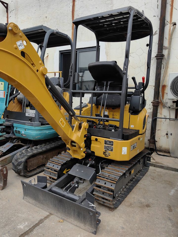 2026 XCMG XE17U Mini Excavator with its yellow boom and dozer blade extended forward.