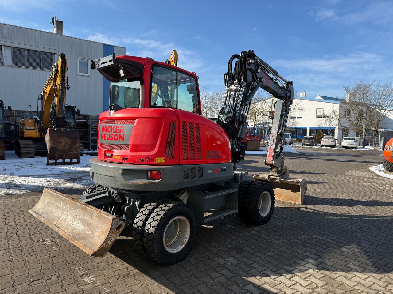 2019 Wacker Neuson EW65 wheel excavator, rear three-quarter view