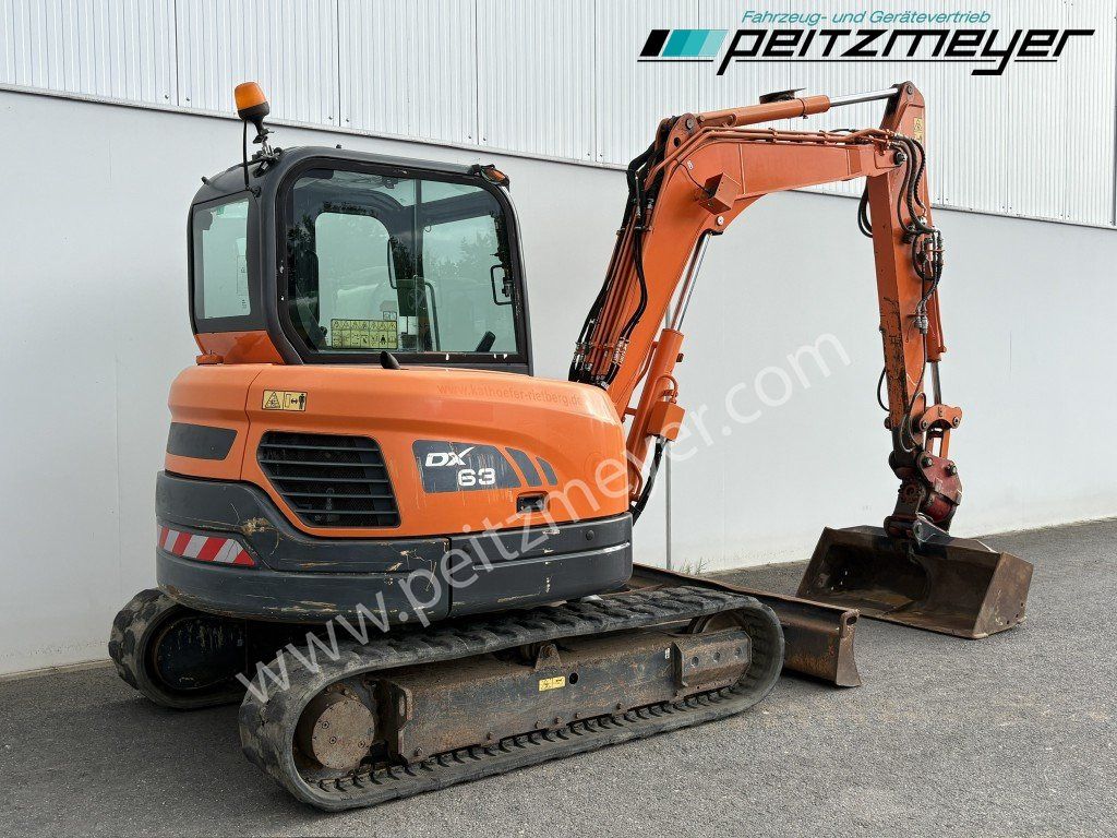2018 Doosan DX63-3 mini excavator, rear three-quarter view 2018 Doosan DX63-3 mini excavator, rear three-quarter view