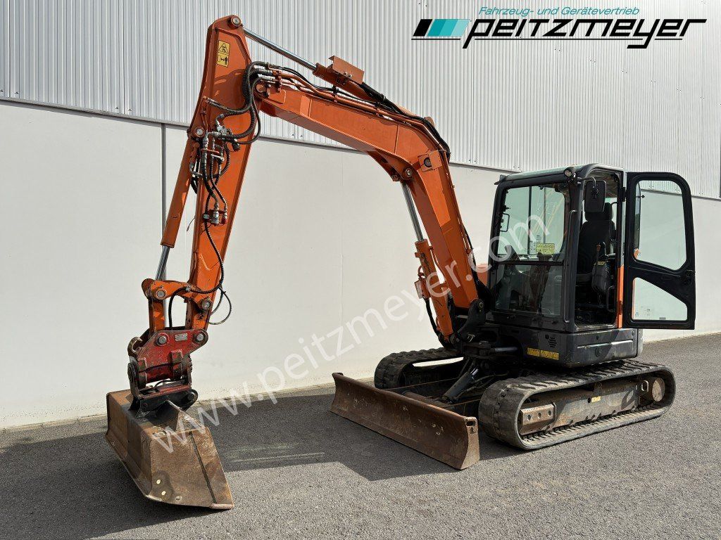 2018 Doosan DX63-3 mini excavator, side view 2018 Doosan DX63-3 mini excavator, side view
