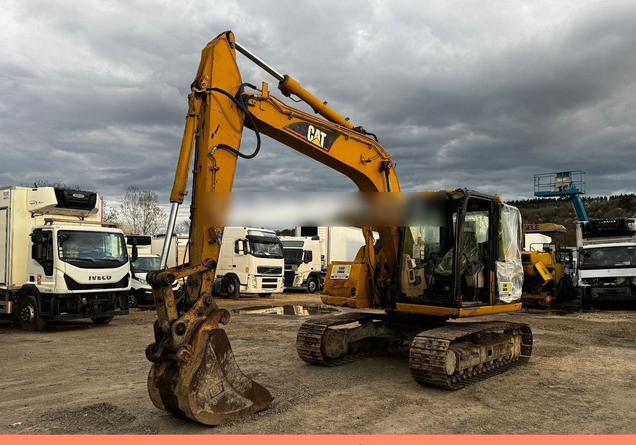 2005 Caterpillar 311C crawler excavator, side view