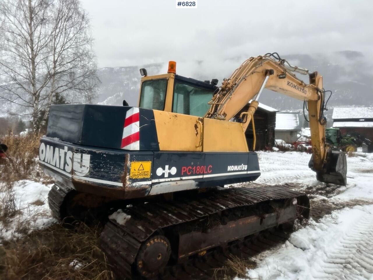 Komatsu PC180LC-3 excavator, rear three-quarter view Komatsu PC180LC-3 excavator, rear three-quarter view