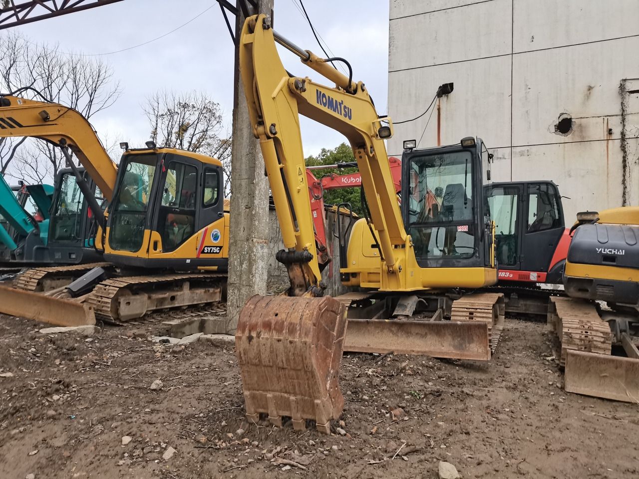 2012 Komatsu PC56-7 mini excavator, front three-quarter view