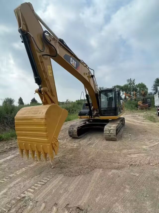 2024 Caterpillar 320D2 crawler excavator, front three-quarter view