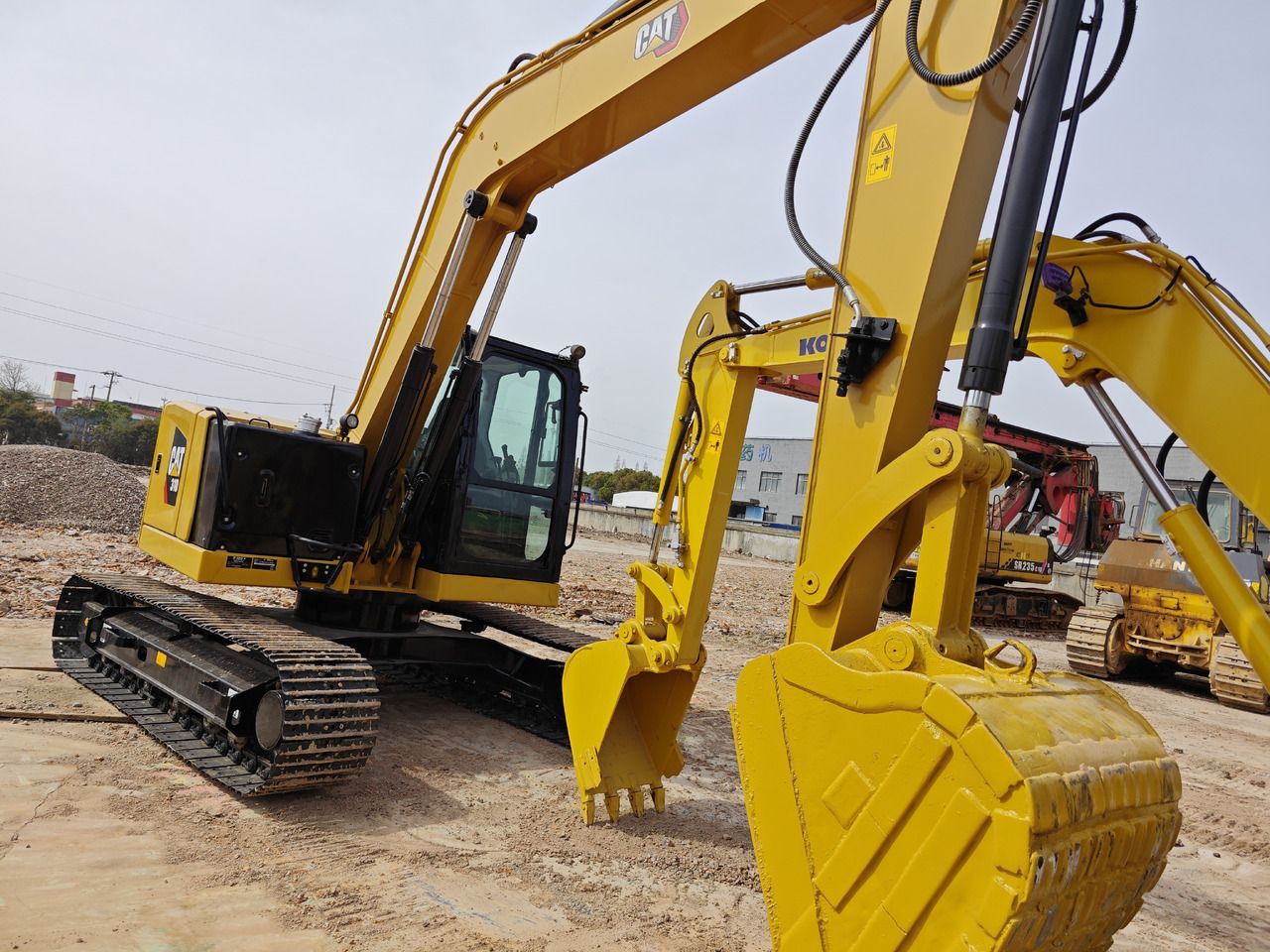 Caterpillar 310 Mini Excavator, rear three-quarter view