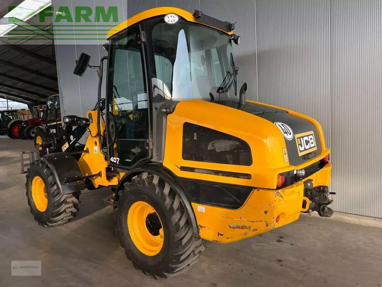 2017 JCB 407 wheel loader, rear three-quarter view 2017 JCB 407 wheel loader, rear three-quarter view