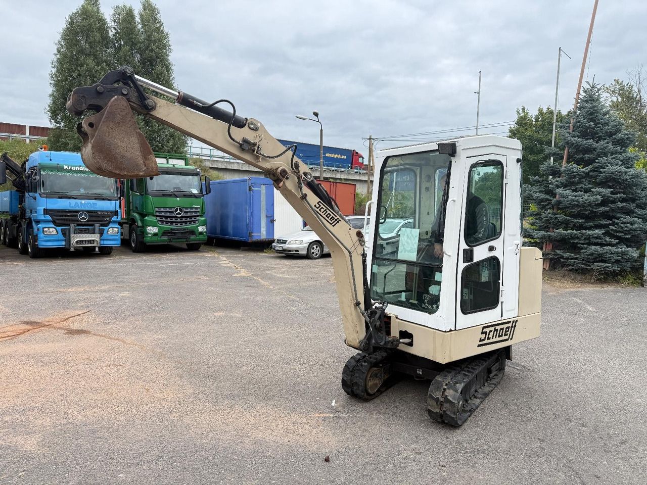 1995 Schaeff HR 12 mini excavator, side view