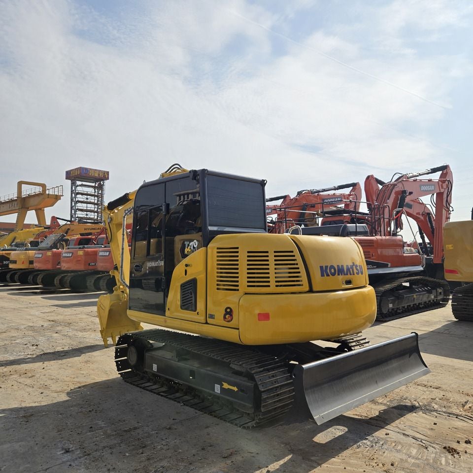 Komatsu PC70-8 mini excavator, rear three-quarter view Komatsu PC70-8 mini excavator, rear three-quarter view