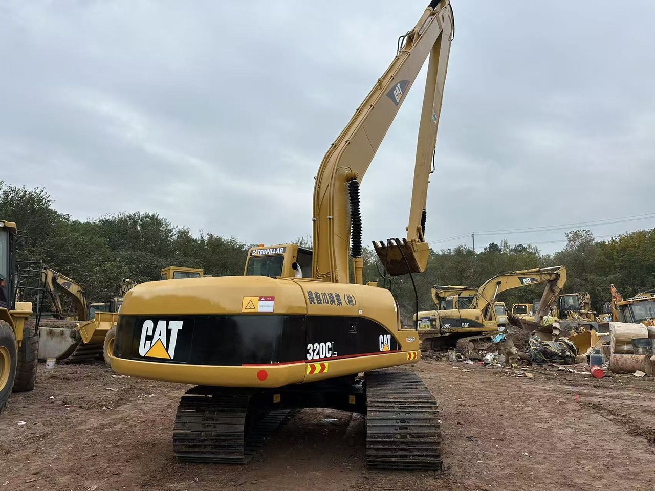 2018 Caterpillar 320CL rupsgraafmachine, achteraanzicht driekwart