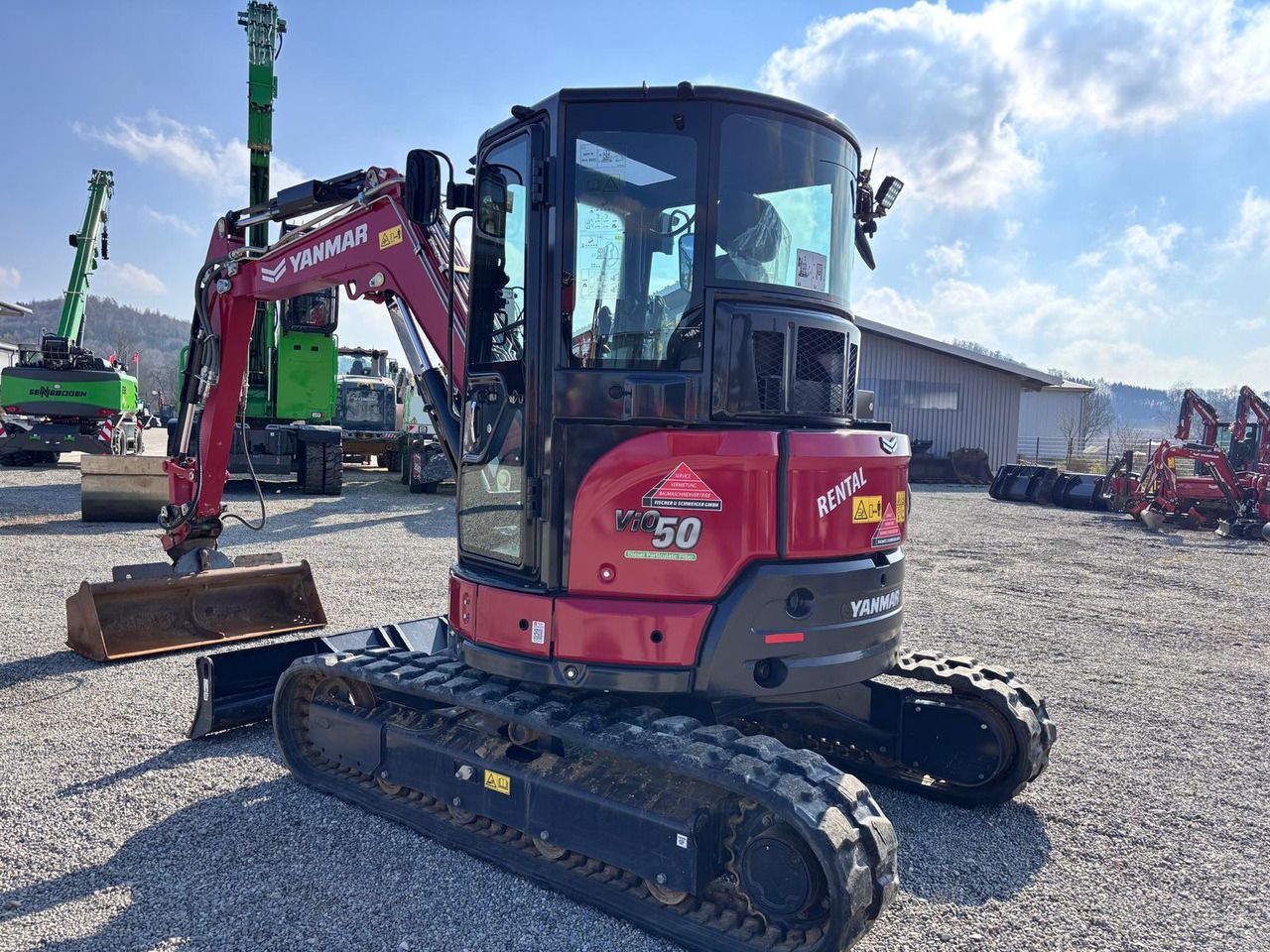 2023 Yanmar VIO50-6 mini excavator, rear three-quarter view