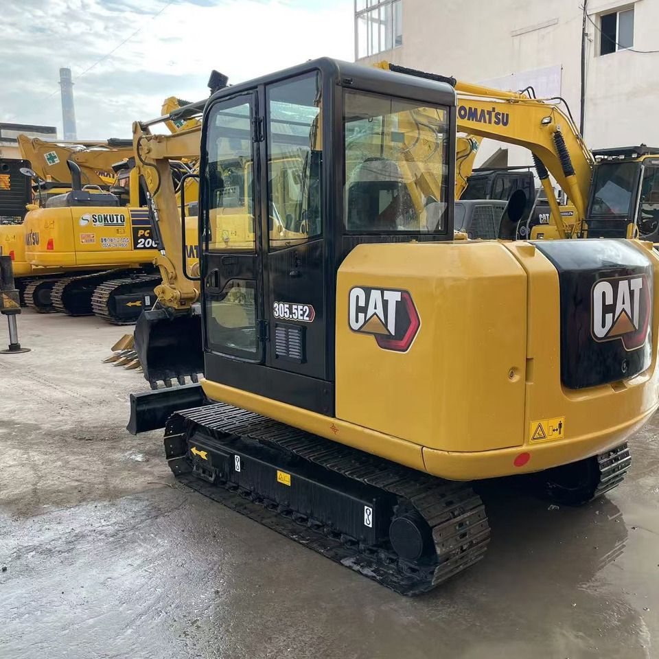 2023 Caterpillar 305.5E2 mini excavator, rear three-quarter view