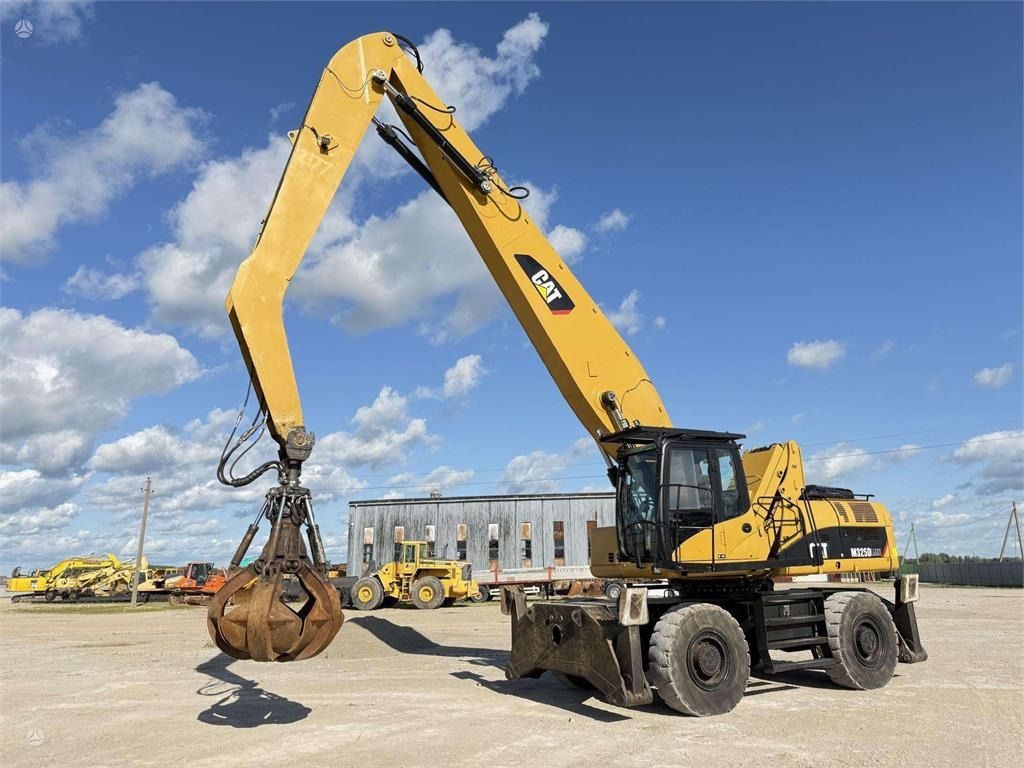 2010 Caterpillar M325D MH wheel excavator, side profile view